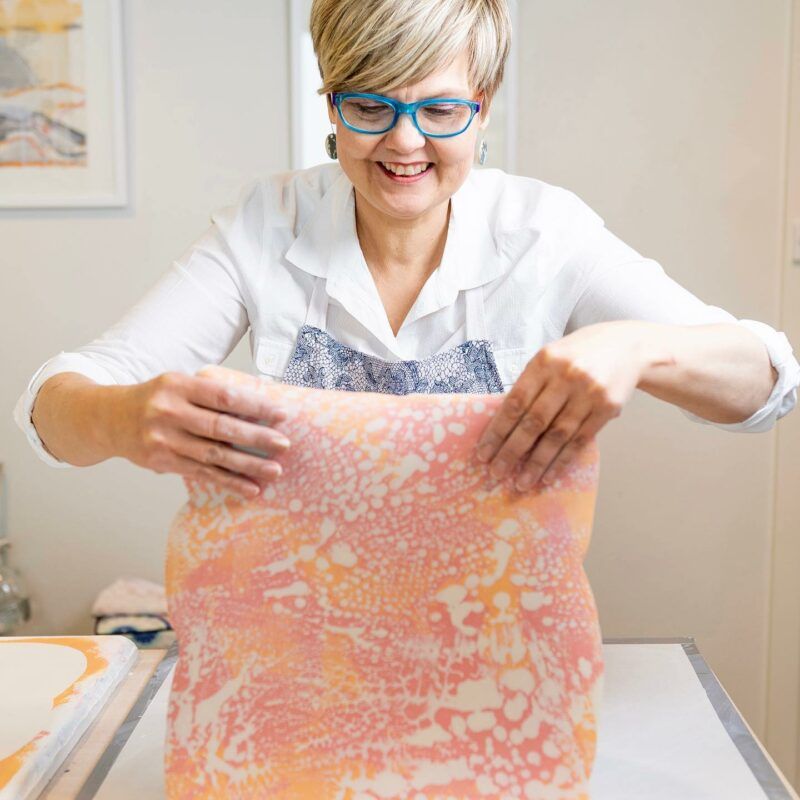 Handmade Ambassador Tania Vrancic Ceramics holding a ceramic sheet.